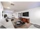 Bright living room with neutral tones, large TV, and plenty of seating options at 8429 Brackenfield Ave, Las Vegas, NV 89178