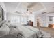 Spacious main bedroom features tray ceilings, ceiling fan, shutters, and cozy fireplace at 8429 Brackenfield Ave, Las Vegas, NV 89178