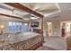 The spacious main bedroom with doors leading to a balcony, fireplace and ensuite bath at 8429 Brackenfield Ave, Las Vegas, NV 89178