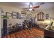 Spacious office with wood floors, custom window treatments and a ceiling fan at 8429 Brackenfield Ave, Las Vegas, NV 89178