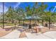 Community picnic pavilion on a walking path with mature shade trees at 8429 Brackenfield Ave, Las Vegas, NV 89178