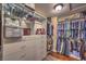 Walk-in closet includes built-in shelving and wooden floor at 8429 Brackenfield Ave, Las Vegas, NV 89178