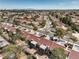 An aerial shot showcasing red-tiled roofs, manicured yards, and community at 8552 Desert Holly Dr, Las Vegas, NV 89134