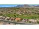Expansive aerial view showcases the community, golf course, mountain views, and meticulously planned residential layout at 8552 Desert Holly Dr, Las Vegas, NV 89134