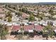 Overhead view of a neighborhood showcasing multiple red-tiled roofs at 8552 Desert Holly Dr, Las Vegas, NV 89134