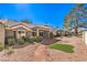 This backyard has desert landscaping, patio, gravel, and bushes at 8552 Desert Holly Dr, Las Vegas, NV 89134