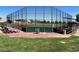 A well-maintained baseball field with bleachers, fencing, and a dugout area, offering a great community sports amenity at 8552 Desert Holly Dr, Las Vegas, NV 89134
