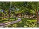 Beautiful community park featuring lush green spaces, walking paths, picnic areas, and mature trees for leisure activities at 8552 Desert Holly Dr, Las Vegas, NV 89134