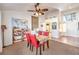Cozy dining area features a ceiling fan, tiled flooring, and bright, natural light at 8552 Desert Holly Dr, Las Vegas, NV 89134