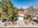 Charming one-story home featuring a well-manicured front yard and a two-car garage at 8552 Desert Holly Dr, Las Vegas, NV 89134