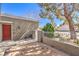 Front of home featuring a brick-paved patio and secure privacy fence at 8552 Desert Holly Dr, Las Vegas, NV 89134