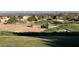 Scenic view of golf course, with lush greenery, landscaping and city skyline in the distance, offering a tranquil backdrop at 8552 Desert Holly Dr, Las Vegas, NV 89134