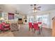Open-concept living room with dining area, cozy seating, fireplace, and natural lighting at 8552 Desert Holly Dr, Las Vegas, NV 89134