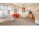 Spacious living room with fireplace, neutral walls and large windows providing natural light at 8552 Desert Holly Dr, Las Vegas, NV 89134