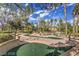 Charming mini golf course with manicured landscaping and blue sky views at 8552 Desert Holly Dr, Las Vegas, NV 89134