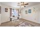 Office space with a ceiling fan, a large window, and a stylish rug at 8552 Desert Holly Dr, Las Vegas, NV 89134