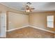 Bedroom with a ceiling fan and a large window at 8851 Quintane Ln, Las Vegas, NV 89123