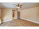 Bedroom with doorway access, ceiling fan and window views at 8851 Quintane Ln, Las Vegas, NV 89123