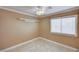 This bedroom features neutral walls, tiled floors, and a bright window at 8851 Quintane Ln, Las Vegas, NV 89123