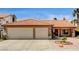 Charming home with a two-car garage, terracotta roof, and well-maintained landscaping at 8851 Quintane Ln, Las Vegas, NV 89123
