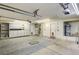 Spacious garage with ample storage cabinets, overhead lighting, and water heater at 8851 Quintane Ln, Las Vegas, NV 89123