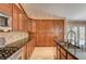 Bright kitchen with stainless steel appliances, granite counters, beautiful cabinets and access to backyard at 8851 Quintane Ln, Las Vegas, NV 89123