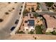 Aerial view of a modern home with solar panels, green lawn and a cozy outdoor patio area at 8853 Autumn Teal Ave, Las Vegas, NV 89178
