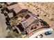 Aerial view showcasing a modern home with solar panels, a manicured yard, and adjacent neighborhood streets at 8853 Autumn Teal Ave, Las Vegas, NV 89178