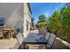 Backyard with stone accents, dining table, landscaped area, and lush landscaping at 8853 Autumn Teal Ave, Las Vegas, NV 89178