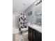 This bathroom has a granite-top vanity and a tub shower with a curtain at 8853 Autumn Teal Ave, Las Vegas, NV 89178