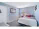 This bedroom has a soft color palette, window with blinds, and decorative art at 8853 Autumn Teal Ave, Las Vegas, NV 89178