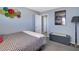 This bedroom is a comfortable space with a storage bench at the foot of the bed at 8853 Autumn Teal Ave, Las Vegas, NV 89178