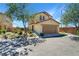 Inviting two-story home with a well-maintained front yard and attached two-car garage at 8853 Autumn Teal Ave, Las Vegas, NV 89178