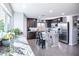Bright kitchen with granite counters, stainless appliances, and a marble-topped island with seating at 8853 Autumn Teal Ave, Las Vegas, NV 89178