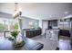Bright open concept kitchen with stainless steel appliances, light gray walls, and dark wood cabinets at 8853 Autumn Teal Ave, Las Vegas, NV 89178