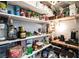 A well-stocked walk-in pantry with an abundance of canned goods, snacks, drinks, and a coffee station at 8853 Autumn Teal Ave, Las Vegas, NV 89178