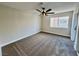 Carpeted bedroom featuring a ceiling fan and natural light from the window at 8913 Saint Pierre Dr, Las Vegas, NV 89134