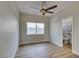 Neutral bedroom with wood flooring and large window overlooking the backyard at 8913 Saint Pierre Dr, Las Vegas, NV 89134