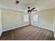 Bright carpeted bedroom with natural light, ceiling fan and neutral paint at 8913 Saint Pierre Dr, Las Vegas, NV 89134