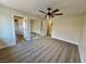 Spacious carpeted bedroom with ceiling fan, neutral paint, and mirrored closet at 8913 Saint Pierre Dr, Las Vegas, NV 89134