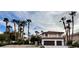 Exterior view of a two-story home with a two-car garage and mature landscaping at 8913 Saint Pierre Dr, Las Vegas, NV 89134
