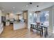 Bright kitchen with granite countertops, white cabinets, and a view to the backyard pool at 8913 Saint Pierre Dr, Las Vegas, NV 89134