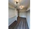 A large walk-in closet features carpeted floors, hanging racks, and a ceiling light fixture at 8913 Saint Pierre Dr, Las Vegas, NV 89134