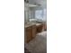 Bathroom featuring double sinks, tile flooring, a vanity, and a glass shower enclosure at 9162 Weeping Hollow Ave, Las Vegas, NV 89178