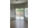 Bedroom with tan floors and windows overlooking the backyard at 9162 Weeping Hollow Ave, Las Vegas, NV 89178