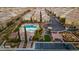 Aerial view of a community with a pool, playground, parking, and well-maintained landscaping at 9494 Alma Ridge Ave, Las Vegas, NV 89178