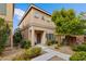 Charming two-story home featuring a landscaped front yard and inviting entrance at 9494 Alma Ridge Ave, Las Vegas, NV 89178