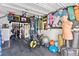 The garage is fully equipped with a bike rack, storage shelves, and workout equipment at 9494 Alma Ridge Ave, Las Vegas, NV 89178