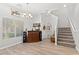 Inviting living area with lots of natural light, modern flooring and open staircase at 9494 Alma Ridge Ave, Las Vegas, NV 89178