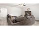 Spacious living room with a large sectional sofa and modern entertainment setup at 9494 Alma Ridge Ave, Las Vegas, NV 89178